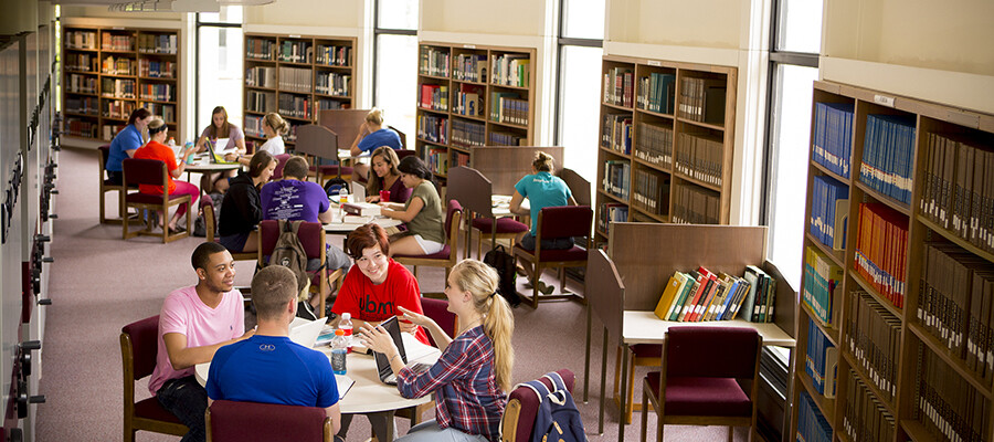 Students study and enjoy each other's company in the Marian University library.