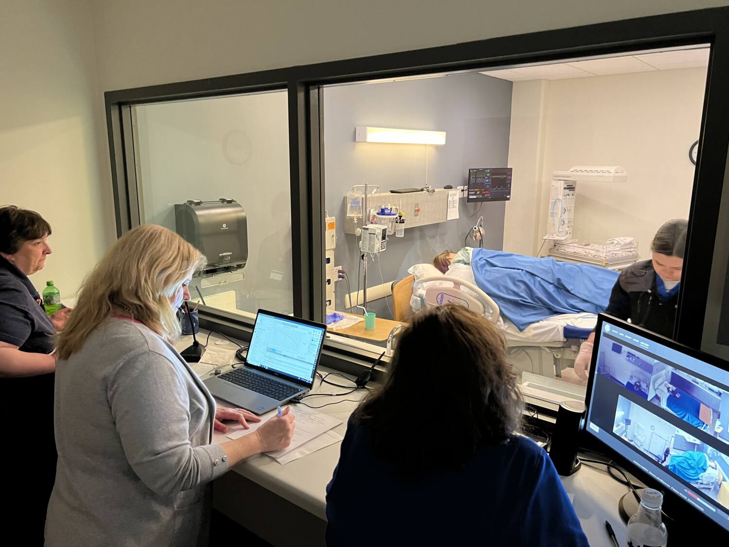 Staff members in a simulation lab